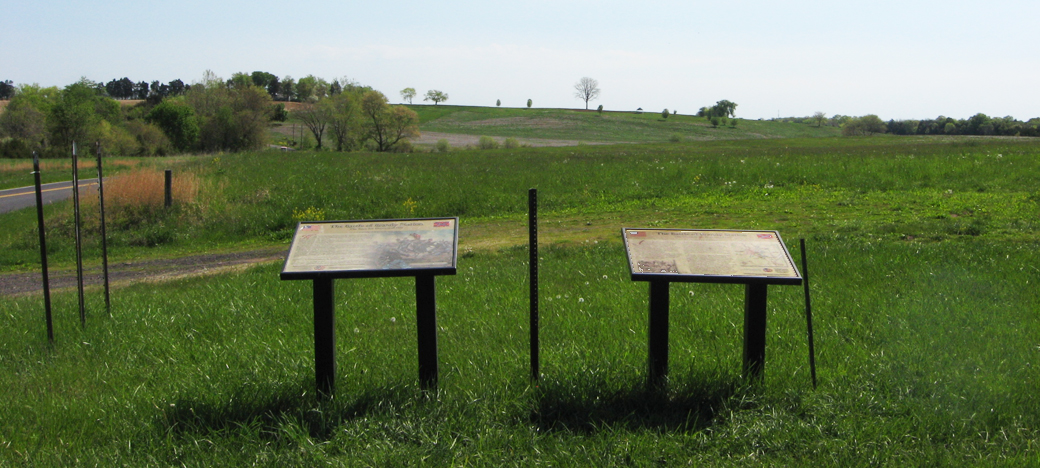 Two wayside markers face Fleetwood Hill on the Brandy Station battlefield