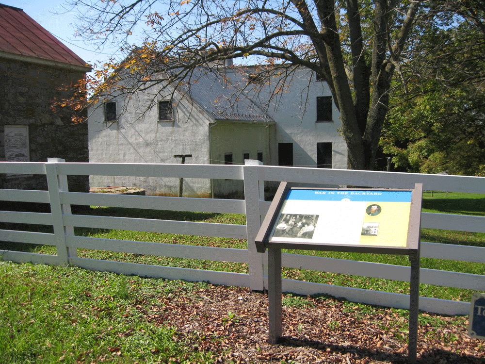 The War in the Backyard wayside marker is in the backyard of the Rose Farm, site of the First Battle of Kernstown in 1862.