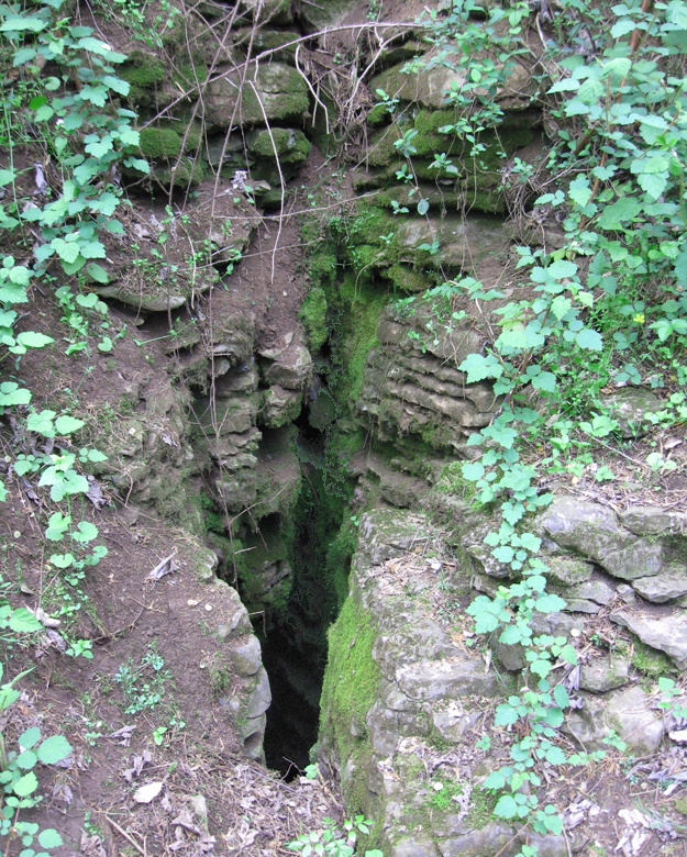 The mouth of Keyhole Cave on the Hupp's Hill Civil War/Karst Interpretive Walking Trail at the Hupp's Hill Civil War Park north of Strasburg, Virginia.
