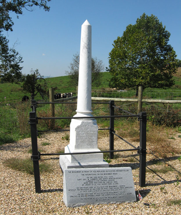 The Post-Appomattox Tragedy monument to Captain George Summers and Sergeant Newton Koontz along with a marker reproducing the monument's inscriptions and a sign explaining the markers and their sponsorship