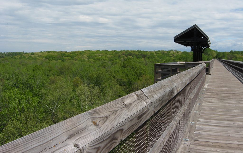 High Bridge of the Appomattox River showing the view from the middle of the bridge along with the covered bech.