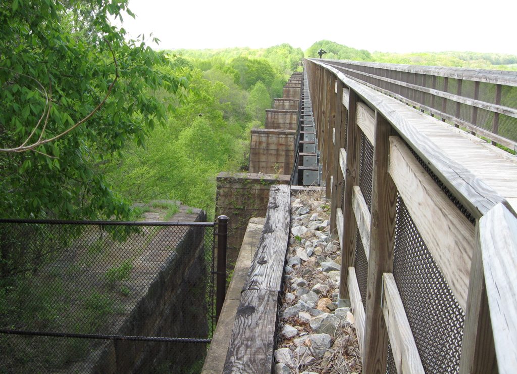 Looking west from the east end of the bridge. The original brick piers can be seen just below and to the left of the current piers.