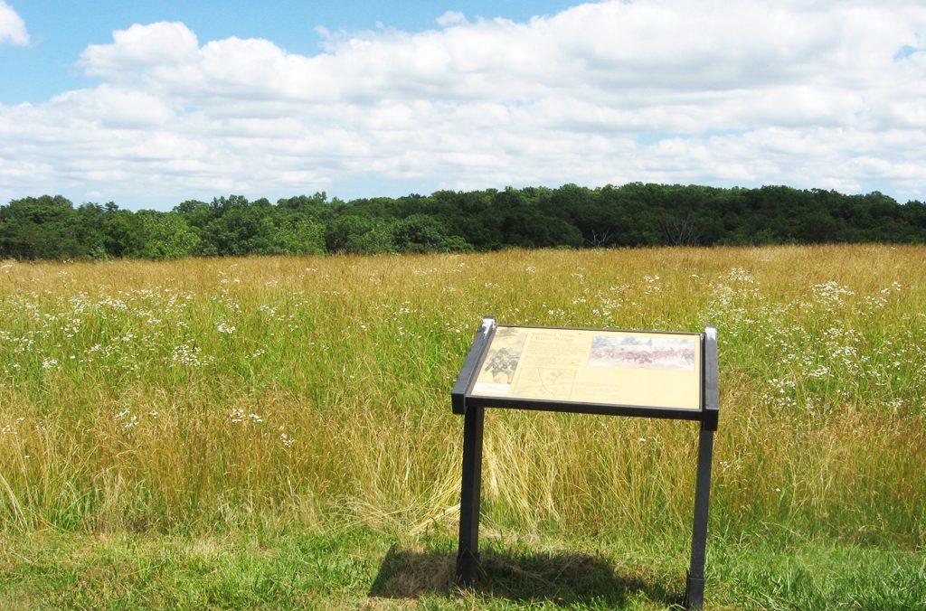 The Retreat from Chinn Ridge wayside marker is along the Chinn Ridge trail on the Manassas National Battlefield.