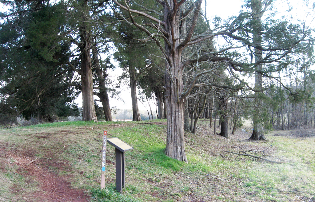 The Unfinished Railroad trailside marker is next to the parking area at Stop 5 on the Manassas Battlefield Driving Tour.