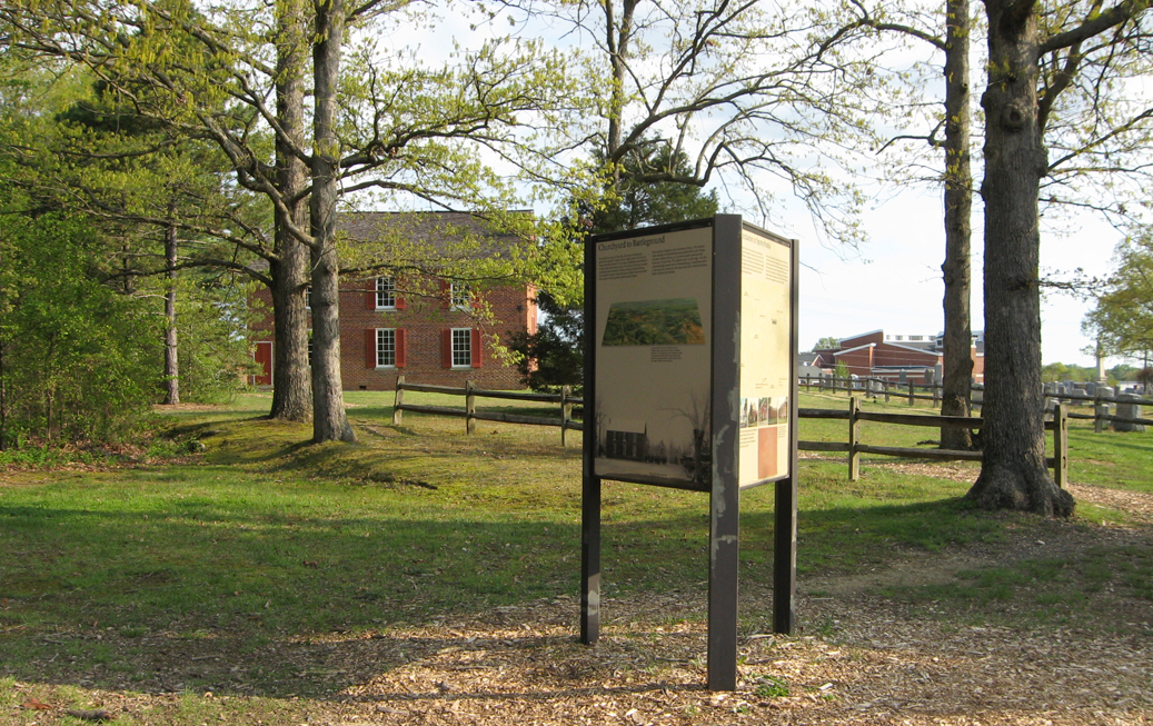 Set of three orientation markers next to the parking area at Historic Salem Church. The church is in the background.