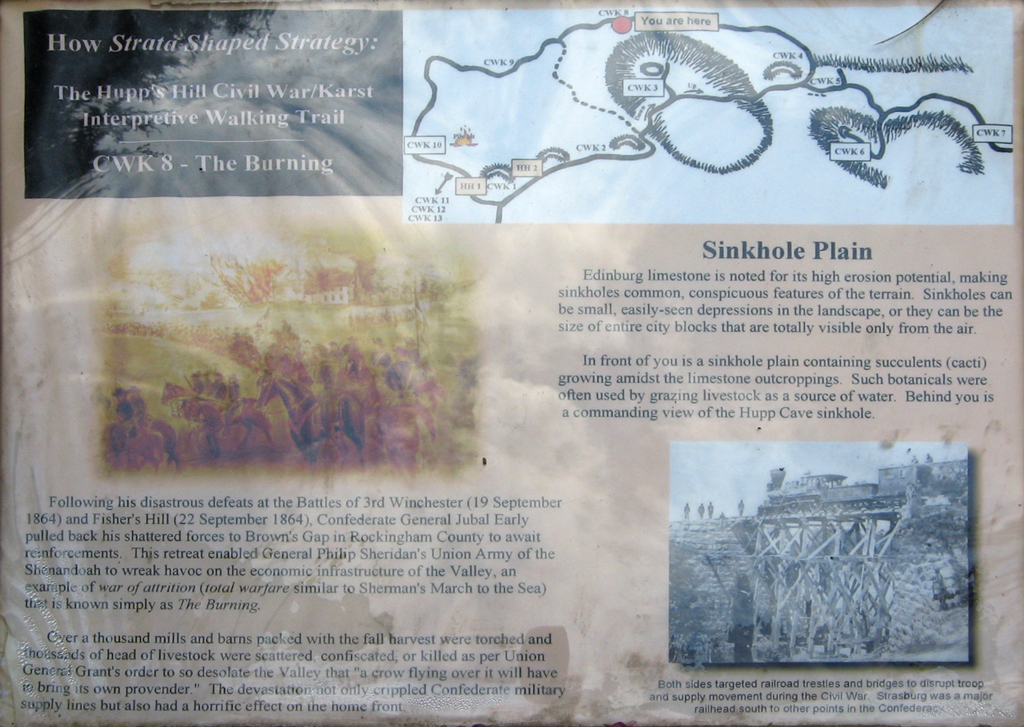 The Burning CWK 8 trail marker is on the Hupp's Hill Civil War/Karst Interpretive Walking Trail at the Hupp's Hill Civil War Park north of Strasburg, Virginia.