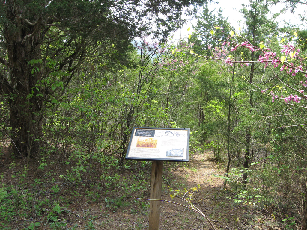 The Burning CWK 8 trail marker is on the Hupp's Hill Civil War/Karst Interpretive Walking Trail at the Hupp's Hill Civil War Park north of Strasburg, Virginia.